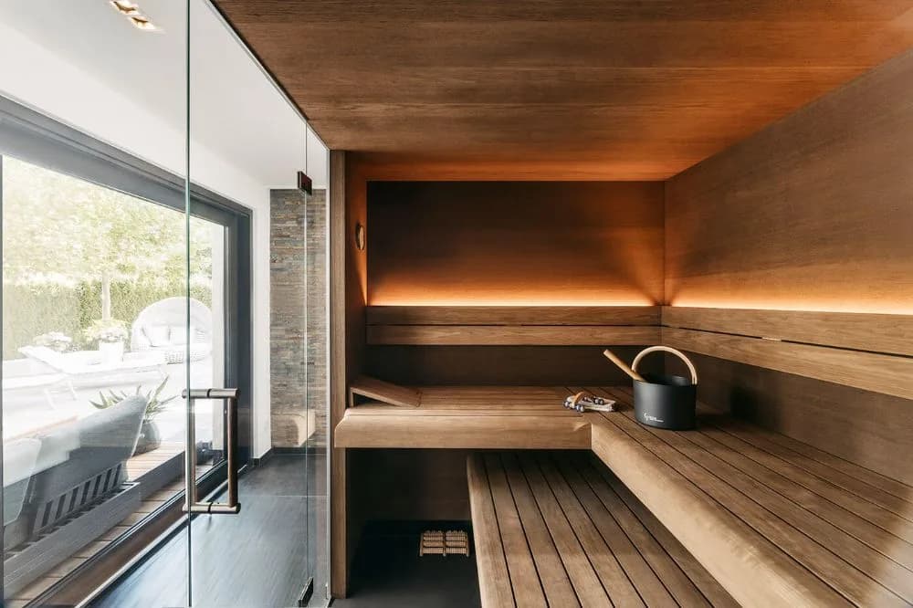 People relaxing in a Lowlu sauna and cold plunge space in London